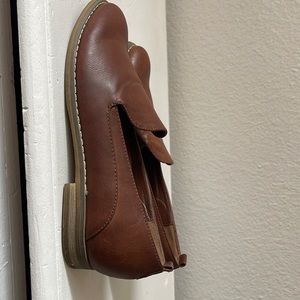 Brown leather shown with wood bottoms